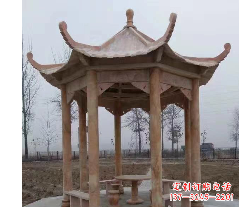 南通公园晚霞红八角石雕凉亭